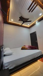 Postel nebo postele na pokoji v ubytování Hotel Mahika