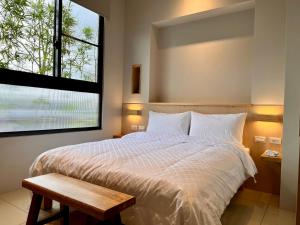 Postel nebo postele na pokoji v ubytování 不想上班 宜蘭民宿-Don't Wanna Work B&B