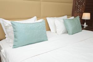 Postel nebo postele na pokoji v ubytování Dimond Vision Hotel