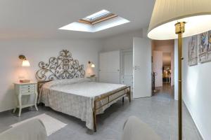a bedroom with a large bed in a room at Casa Lydia in Rio nellʼElba