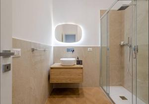 a bathroom with a sink and a glass shower at Residenza Camillo - Palermo Centro in Palermo +49 photos
