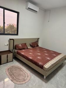 Ένα ή περισσότερα κρεβάτια σε δωμάτιο στο Apartment for rent in Kinshasa Gombe
