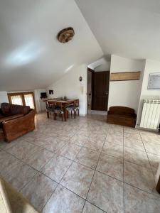 a living room with a couch and a table at Maison Camigliati in Camigliatello Silano