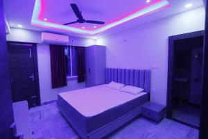 Ένα ή περισσότερα κρεβάτια σε δωμάτιο στο Eastern Heights Residency