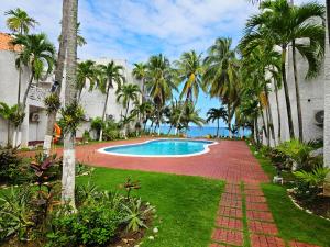 The swimming pool at or close to Chrisanns Paradise Suite by the Ocean - Apt#9