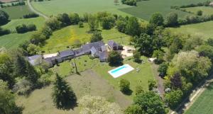 an aerial view of a large estate with a swimming pool at Les Roberderies in Broc