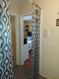 a room with a door open to a bedroom at Burbank Airport Universal City in Hollywood Burbank Airport