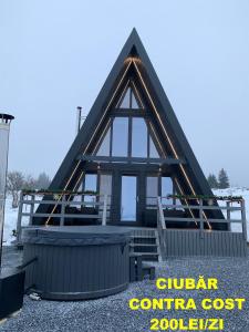 a house being constructed with a gambrel roof at Chalet Charme Bucovina in Coşna