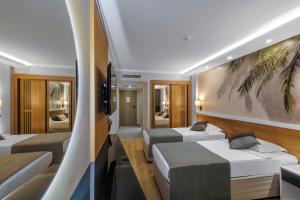 Postel nebo postele na pokoji v ubytování Alba Resort Hotel - Ultra All Inclusive