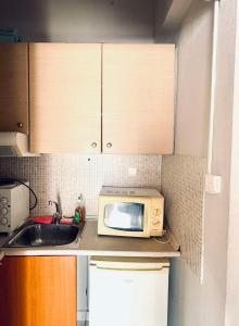 O bucătărie sau chicinetă la Cozy apartment 2