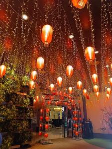 a room with chinese lanterns hanging from the ceiling at Holiday Escape Philippines in Manila +204 photos