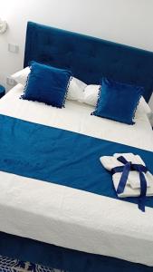 Postel nebo postele na pokoji v ubytování Palazzo Maiori