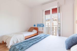 Łóżko lub łóżka w pokoju w obiekcie Condominio International