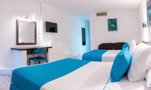 En eller flere senge i et værelse på Howard Johnson by Wyndham Veracruz