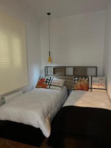 A bed or beds in a room at Alojamientos Rurales Cuatro Estaciones
