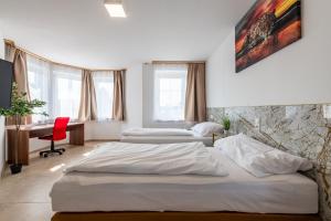 Postel nebo postele na pokoji v ubytování YS Apartments