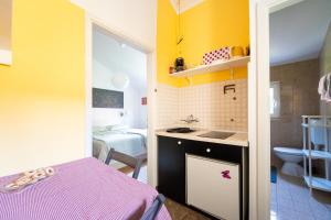 Kuchyň nebo kuchyňský kout v ubytování Art Apartment SeaSoul