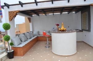 a living room with a couch and a table at Maison bien équipée in Tiznit