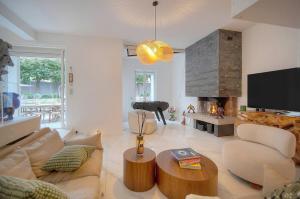 a living room with a couch and a fireplace at FRGK "VILLA La Cote D'Azur" in Cannes