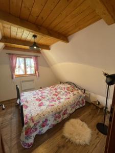 Postel nebo postele na pokoji v ubytování Drevenica u Kobrtkov + 4 fotografie