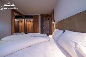 Posteľ alebo postele v izbe v ubytovaní Chalet 1816 by Livigno Accomodation