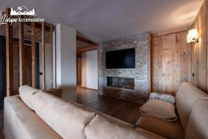Televízia a/alebo spoločenská miestnosť v ubytovaní Chalet 1816 by Livigno Accomodation