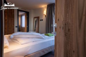 Posteľ alebo postele v izbe v ubytovaní Chalet 1816 by Livigno Accomodation