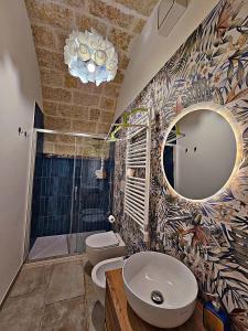 a bathroom with a sink and a mirror at RomAntica - Sunset & Terrace in Polignano a Mare