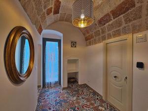a room with a hallway with a door and a ceiling at RomAntica - Sunset & Terrace in Polignano a Mare +74 photos