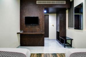 TV a/nebo společenská místnost v ubytování Townhouse Dev's Inn by CJ
