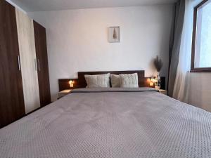 Ένα ή περισσότερα κρεβάτια σε δωμάτιο στο Host2U Belvedere Apartment - Ski in - out - FREE Parking +23 φωτογραφίες