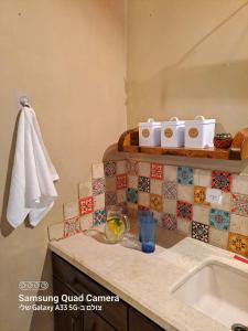 a bathroom with a sink and a counter top at בקצה השמים in Bar Yohai