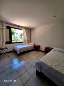 Ένα ή περισσότερα κρεβάτια σε δωμάτιο στο Forno Beach House