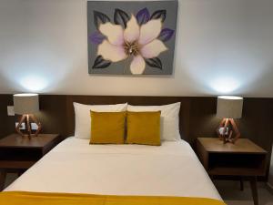 Postel nebo postele na pokoji v ubytování Hotel Faava