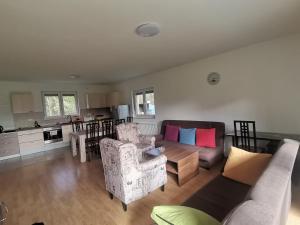 a living room with a couch and a table at Kuća za odmor- Milošev Konak Banja Luka in Novi Kovići