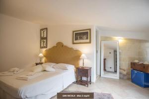 Voodi või voodid majutusasutuse Chiesa Greca Suites - Lecce Selection toas