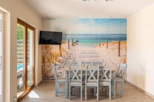 a boardwalk to the beach peel and stick wall mural at Morski domek in Dębki