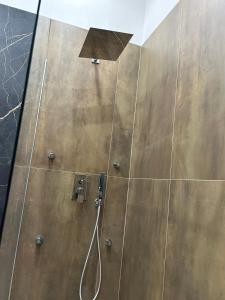 a shower with a shower head and a shower head at Sweet dreams in Palermo
