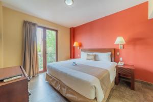 a hotel room with a large bed and a window at Seven Crown La Paz Centro Historico in La Paz