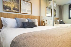 Ένα ή περισσότερα κρεβάτια σε δωμάτιο στο Expand 2958 - Pinheiros +59 φωτογραφίες