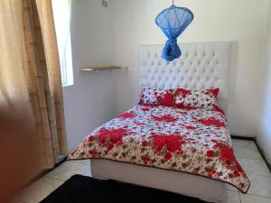 Ένα ή περισσότερα κρεβάτια σε δωμάτιο στο Elgin Guest