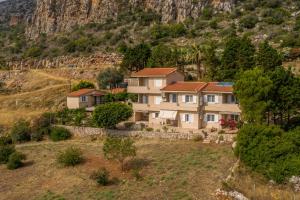 an aerial view of a house in a mountain at iliopetro in Monemvasia