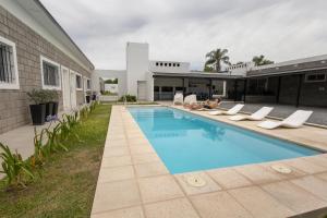 an image of a swimming pool in a house at Apart Hotel Ribera del Baradero - Spa y Piscina Climatizada in Baradero