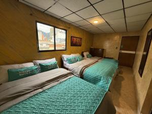 Postel nebo postele na pokoji v ubytování Hotel Suite Centro Bogotá
