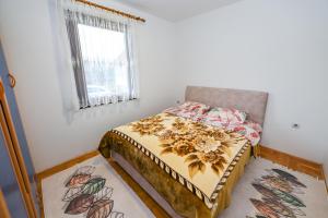 Postel nebo postele na pokoji v ubytování Tim Apartment