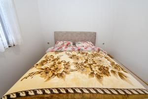 Postel nebo postele na pokoji v ubytování Tim Apartment
