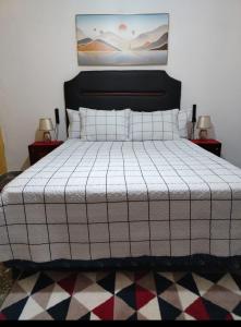 A bed or beds in a room at Hostal Maison Belle