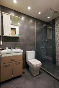 a bathroom with a toilet and a shower and a sink at Residence North Avenue, Teryan 8 , apt14 3 in Yerevan +18 photos