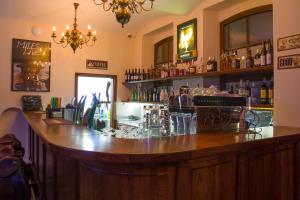 a bar with a large wooden counter in a room at Hotel Sulisław in Sulisław