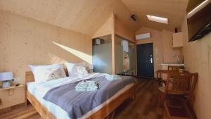 a bedroom with a large bed in a room at Tiny House in Sankt Johann im Pongau